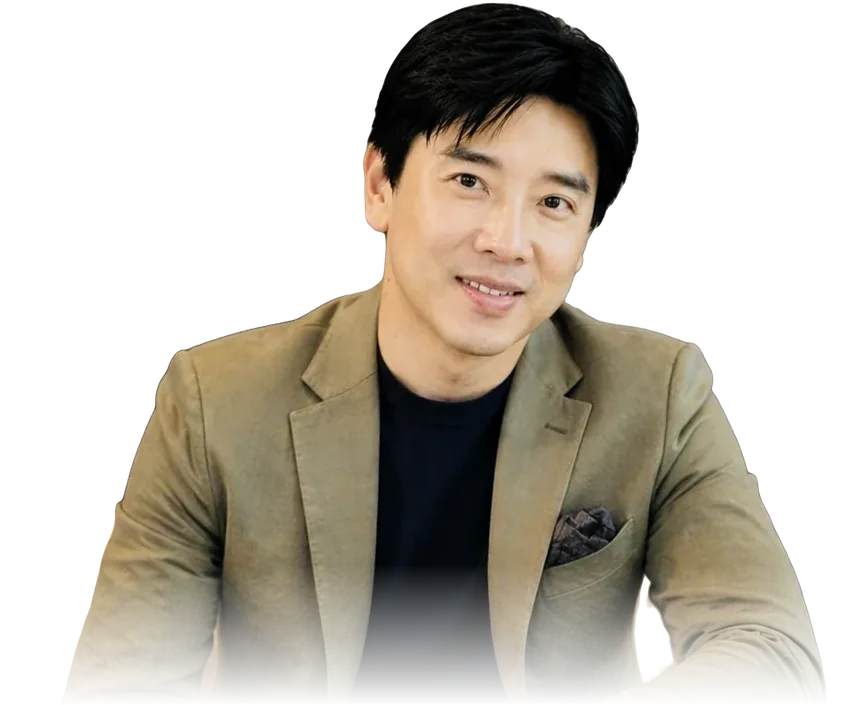 Dato' Seri Ivan Teh in an olive blazer and dark knit, smiling